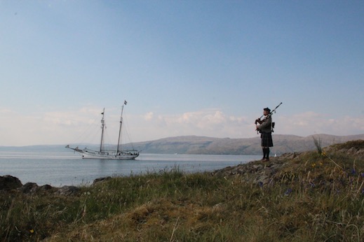 piper with tall ship